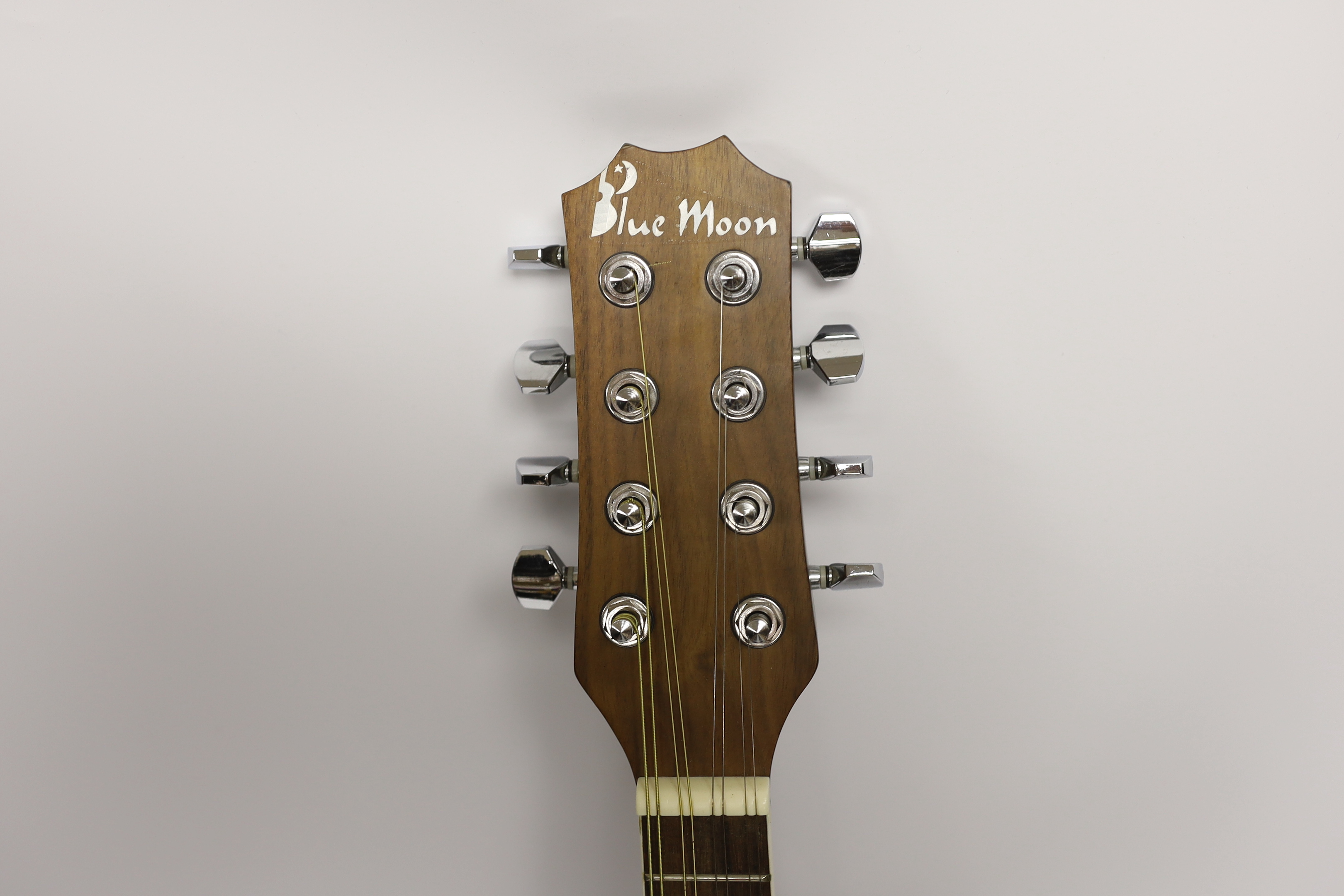 A Blue Moon tenor mandolin, overall length 63cm, in a soft canvas case